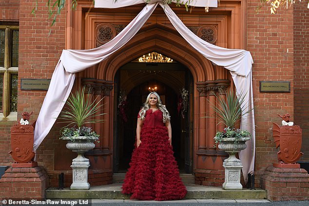 Saffron, 31, put on a glamor display in a striking red ball gown with tulle panel detailing