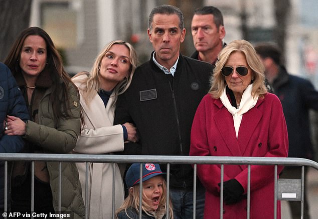 Hunter watches with wife Melissa Cohen on his arm during the Christmas tree lighting on Nantucket