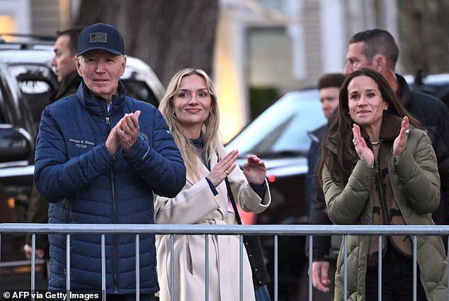 Biden, daughter Ashley and daughter-in-law Melissa Cohen clap while lighting the Christmas tree