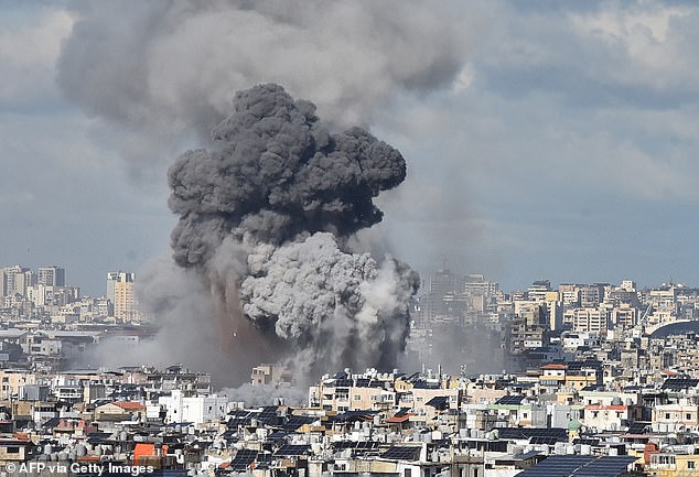 Smoke rises over Beirut's southern suburbs after an Israeli airstrike on November 26