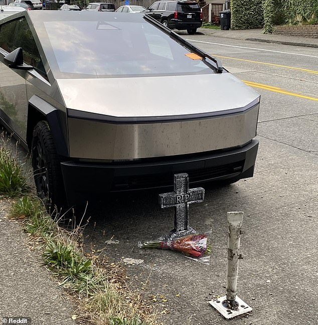 Some visitors placed makeshift memorials around the dead CyberTruck, including a fake stone cross that read 