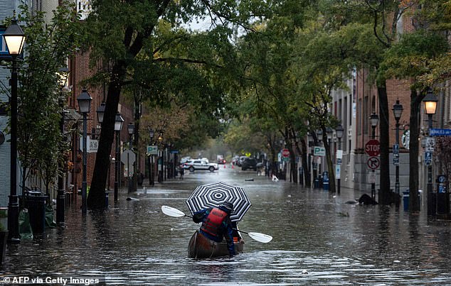 Rising sea levels, hurricanes and sinking land have left parts of the East Coast underwater. Pictured: Heavy rain hit Alexandria, Virginia in 2021, causing some of the worst flooding and damage in decades