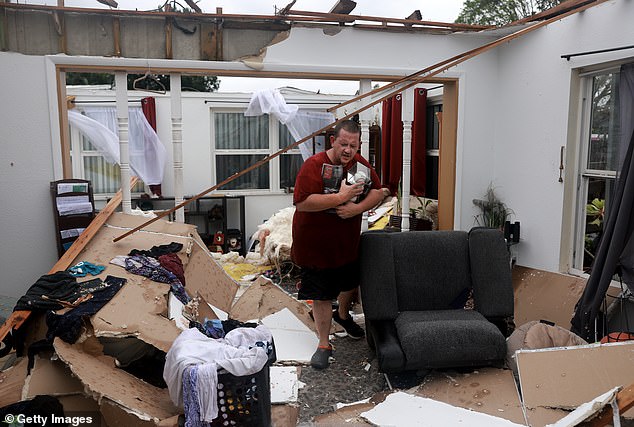 Fort Meyers resident Robert Haight searched the ruins of his home after a Hurricane Milton tornado tore it apart. Milton was made considerably stronger by the warming water