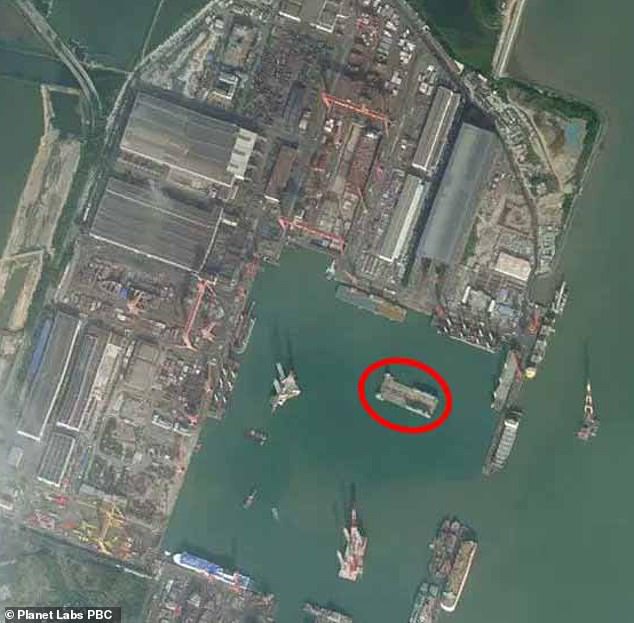 Alarming satellite image shows Chinas 9bn secret warship doing military