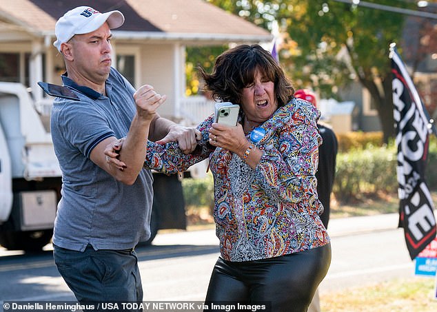 A Trump supporter, left, confronts a Harris fan outside an event for Tim Walz in Bristol Township, Pennsylvania, last week.