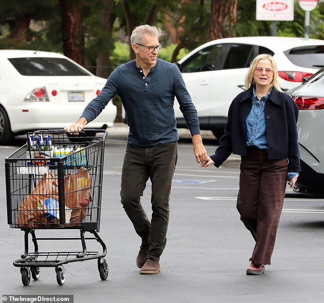 Amy Poehler and her new boyfriend Joel Lovell looked in love as they recently left a Los Angeles supermarket for a rare public outing