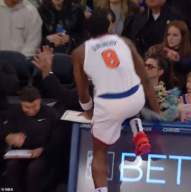 The Devil Wears Prada star was pictured sitting courtside as the 6-foot-2 NBA player charged towards her while chasing the ball