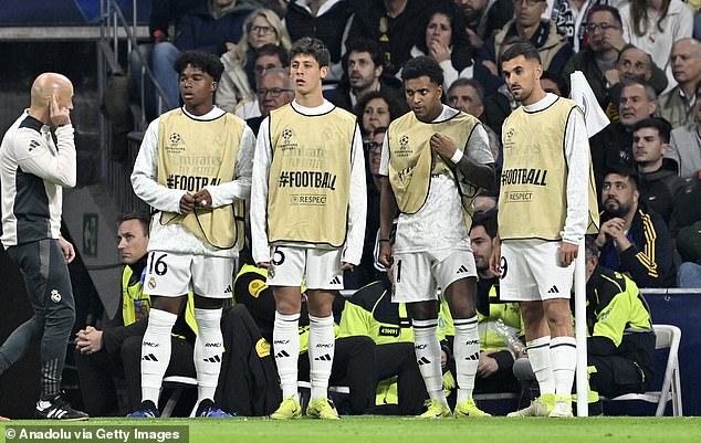 Guler, pictured alongside Real Madrid substitutes, is said to be 'unhappy' at the Bernabéu