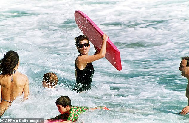 Princess Diana enjoys the waves at Indian Castle Beach in Nevis with William and Harry in 1993