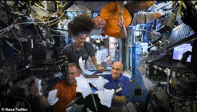 “Brussels sprouts, pumpkin, apples and herbs, and smoked turkey,” explained NASA astronaut Nick Haag (below left), now on his third trip aboard the ISS, as he opened the sealed white packages of the space crew's orbital feast floated in. microgravity. 'It's going to be wonderful'