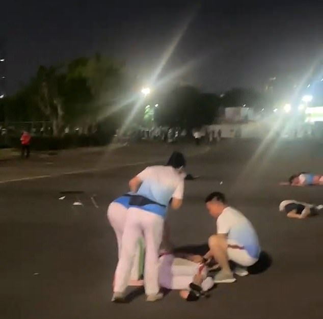 Video footage posted on social media showed dozens of people lying silently on the ground outside the running track of Zhuhai Sports Center in Guangdong province