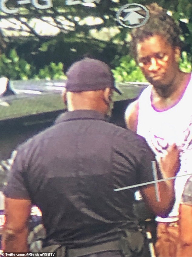 Young Thug is pictured during his arrest in Atlanta's upscale Buckhead neighborhood