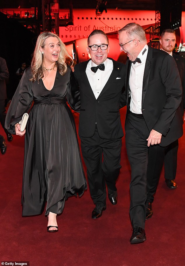 Anthony Albanese (right) is pictured with his partner Jodie Haydon (left) and then Qantas CEO Alan Joyce (centre)