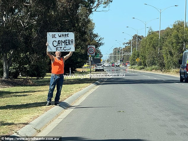 A Melbourne man (pictured) who held up a warning sign to spare motorists on the Princes Highway from a potential speeding fine is being heralded as a 'legend' on social media