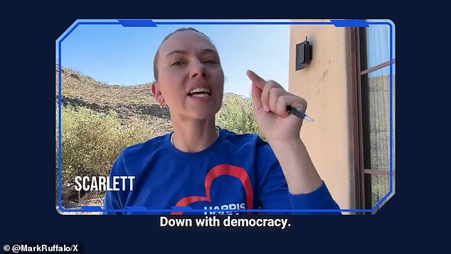 “Down with democracy,” Johansson cheers in the bizarre campaign ad