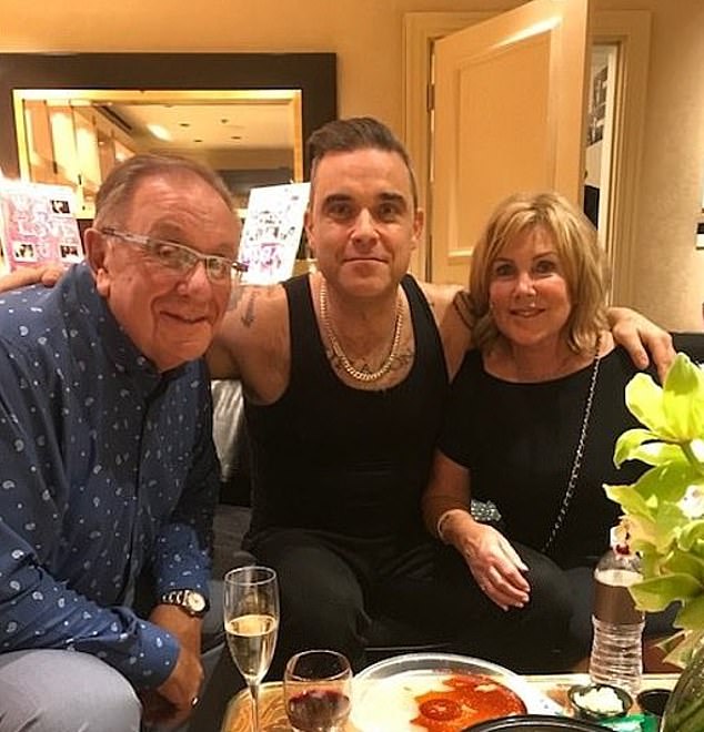 Robbie Williams has revealed that his mother Janet has been diagnosed with dementia. The diagnosis comes four years after the singer revealed his father Pete had Parkinson's (pictured together in 2019)