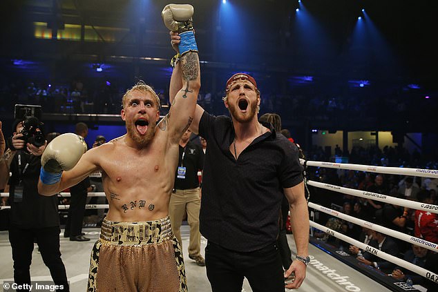 Paul (right) was present when his younger brother, Jake, defeated Mike Tyson in a controversial boxing match