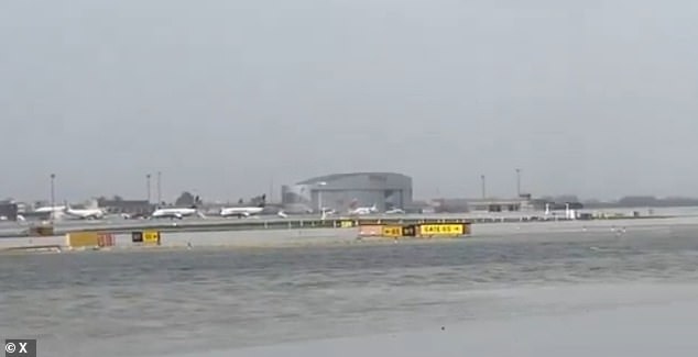 Flooding is seen on the runway of Barcelona's El Prat Airport, with flights being diverted