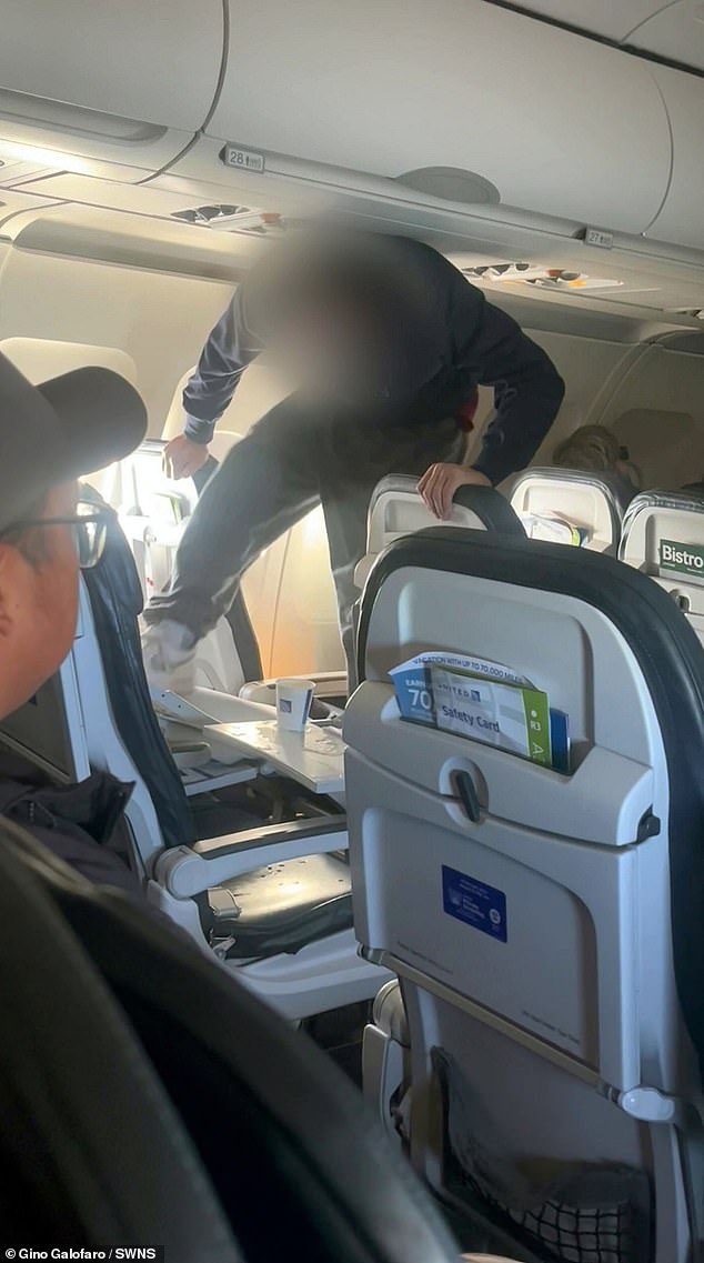 A man was seen repeatedly kicking a seat on a plane before being restrained and restrained by three other passengers on a United Airlines flight from Austin to Los Angeles on November 16.