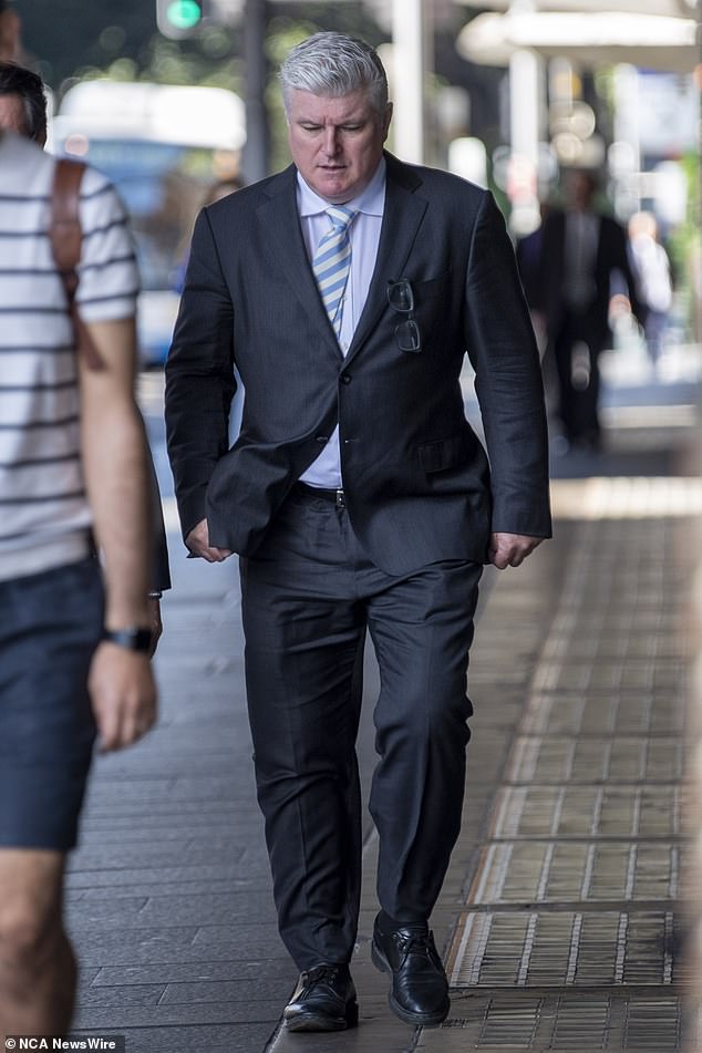 Stuart MacGill is photographed outside a Sydney court on Friday, just before the judge in his trial made a major decision on proceedings