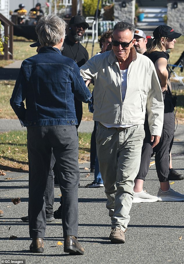 Bruce Springsteen, 75, made a surprise visit to the set of his biopic in Rockaway, New Jersey, on Friday, where he was greeted by Warren Zanes, the author of the book on which the film is based.