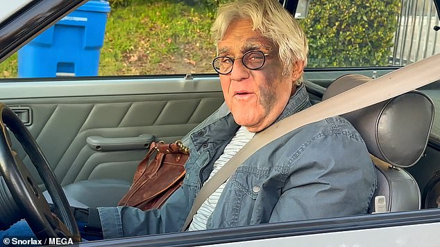 Bruised Jay Leno got back behind the wheel just days after a horrific 60-foot fall left him with a broken wrist and an eye patch