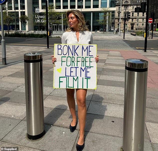 Bonnie Blue is pictured holding a sign saying 'Bonk me for free, let me film it' in Nottingham