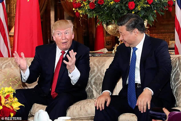 The big unknown: would Chinese President Xi Jinping (right) launch an attack on Taiwan, and would newly-elected President Donald Trump defend the island? Pictured: A meeting of the two leaders in 2017