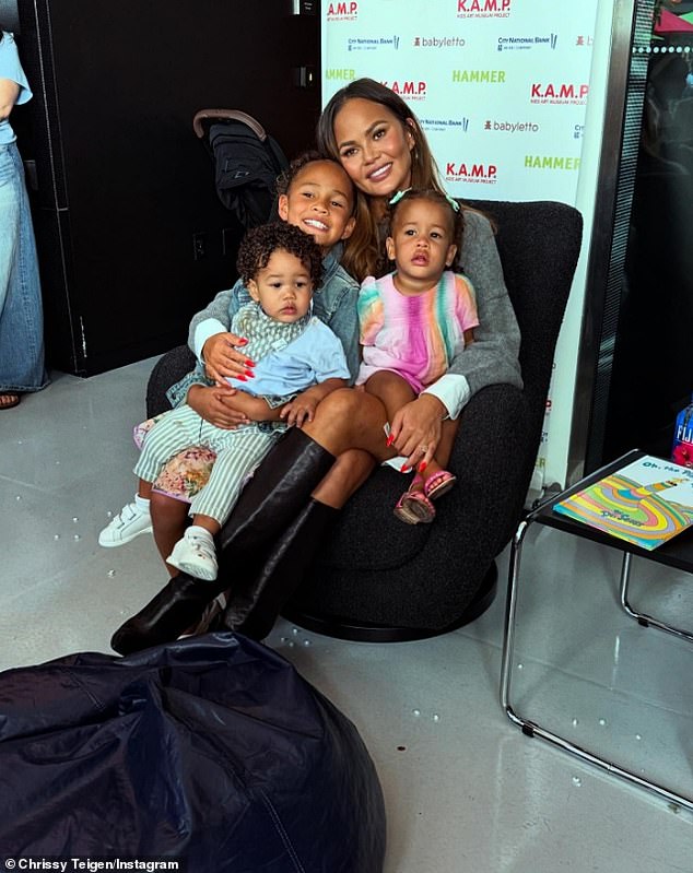 Here she is seen with three of her four children