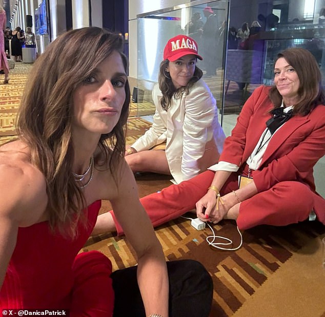 Danica Patrick asked where her Mar-a-Lago invite was while sitting on the floor in a red dress