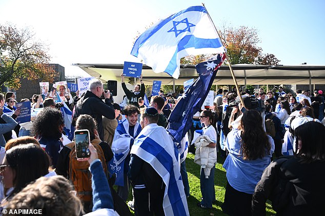 Mr Andrews urged members of the Jewish community to 'defund' organizations that refuse to denounce anti-Semitism or show support for Palestine (photo: a pro-Israel rally in Melbourne earlier this year)