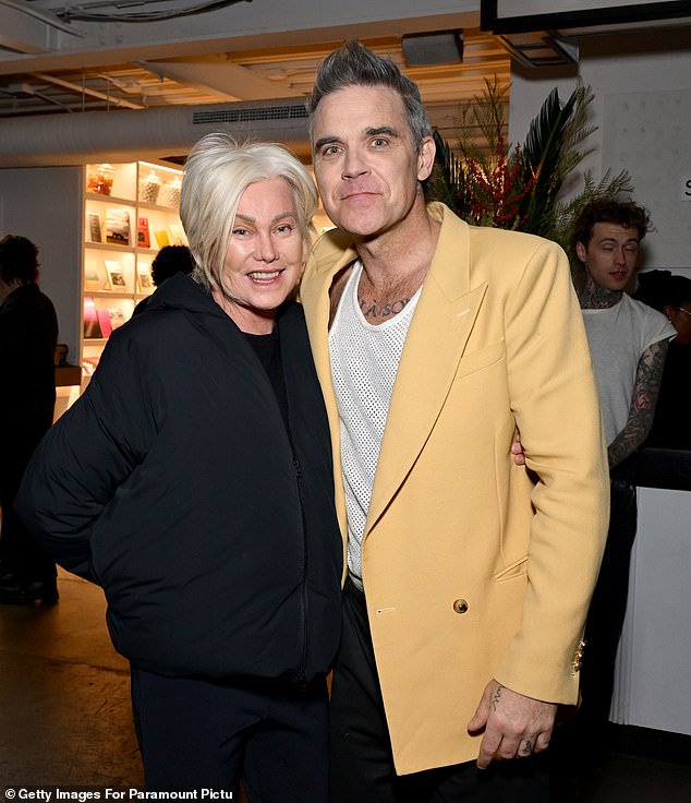 Robbie Williams was a supportive shoulder for Deborra-Lee Furness on Wednesday night as she made a rare red carpet appearance for a screening of her friend's biopic.