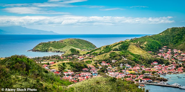 A woman on the island of Guadeloupe who allegedly beheaded her two small children had to be tasered by police and admitted to a psychiatric hospital after she was found naked and singing in the streets.