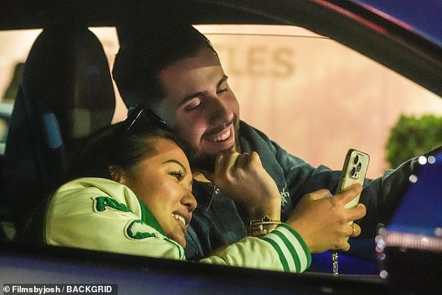 Diddy's baby mama Dana Tran was spotted cozying up with a mystery man in LA on Wednesday - as the disgraced rapper languishes behind bars