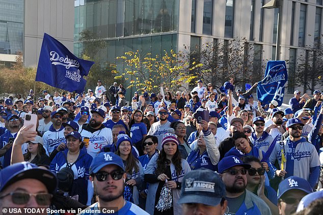 A Los Angeles Dodgers fan was rushed to the hospital after falling from a building during the parade