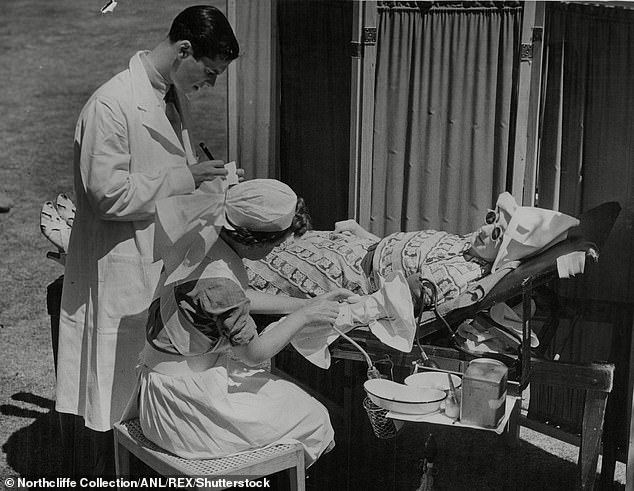 A woman donates blood in the sun during World War II. Blood donation was once much more part of normal life, writes PETER HITCHENS