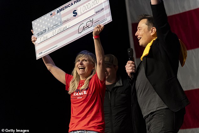 SpaceX and Tesla founder Elon Musk presented Kristine Fishell with a $1 million check during the town hall at the Roxain Theater on October 20, 2024 in Pittsburgh, Pennsylvania