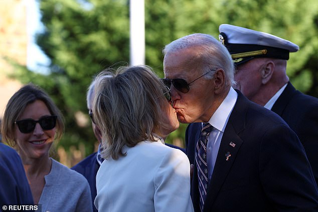 President Joe Biden (right) planted a kiss on the lips of his sister Valerie Biden (left) during a plaque dedication for the late Major Beau Biden, coinciding with Veterans Day