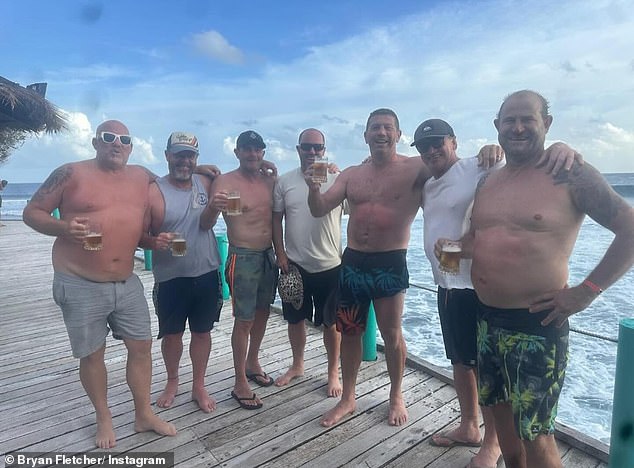 Fletcher (pictured third from right on a previous tropical vacation) ended up having stitches in his foot by a drunken surgeon