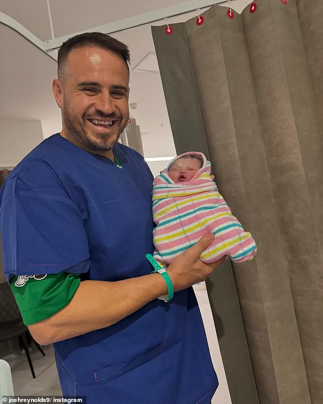 An overjoyed Josh Reynolds is pictured with his newborn daughter Lenora Kelly Nicole Reynolds, who arrived on November 12