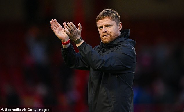 Damien Duff has won his first trophy as a manager by guiding Shelbourne to league glory