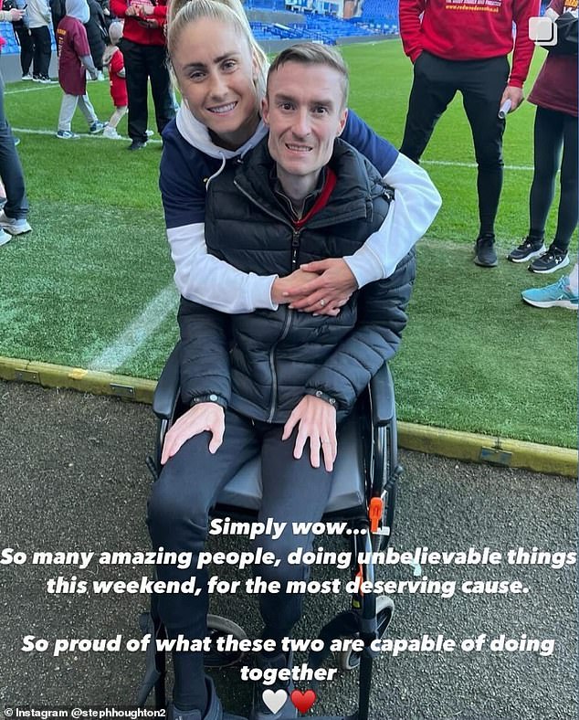 Former Lioness captain Steph Houghton poses for a photo with husband Stephen Darby, 35, after they completed a 175-mile trek to battle motor neurone disease that ended his career