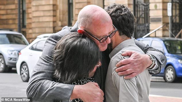 Ms Perrone and Cairo hugged their lawyer Michael Woods after the sentencing on Friday