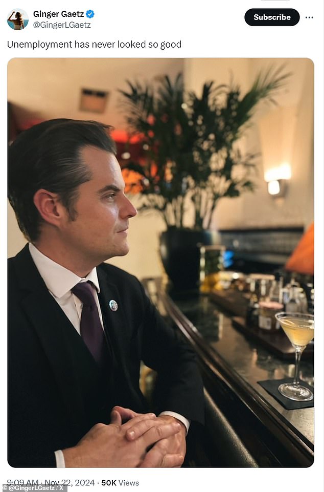 The former congressman is shown in a dark suit at a bar with a martini in front of him.