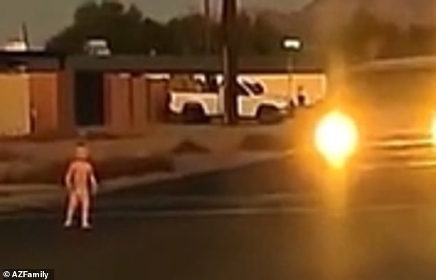 A shocked woman in a nearby car screamed as terrifying vehicles approached the young child