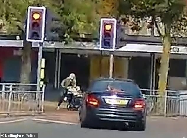 Heartbreaking footage shows the moment a woman narrowly pushes a pram and avoids being run over by a reckless driver during a high-speed police chase