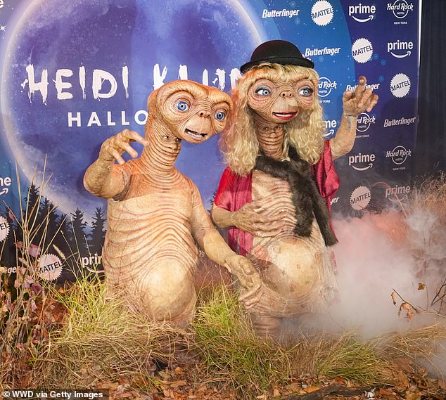 Heidi looked unrecognizable as she transformed into ET for her Halloween couple's costume with husband Tom