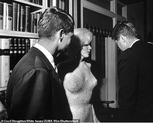 Both John (right) and Robert (left) chat with Marilyn on the night of her infamous performance