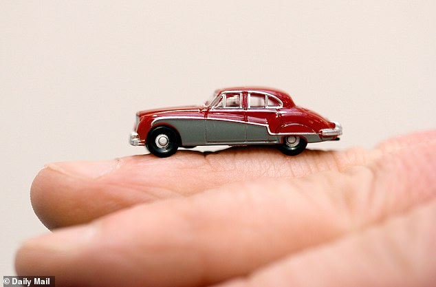 A miniature version of the Jaguar Car from Morse, made by Oxford Diecast.