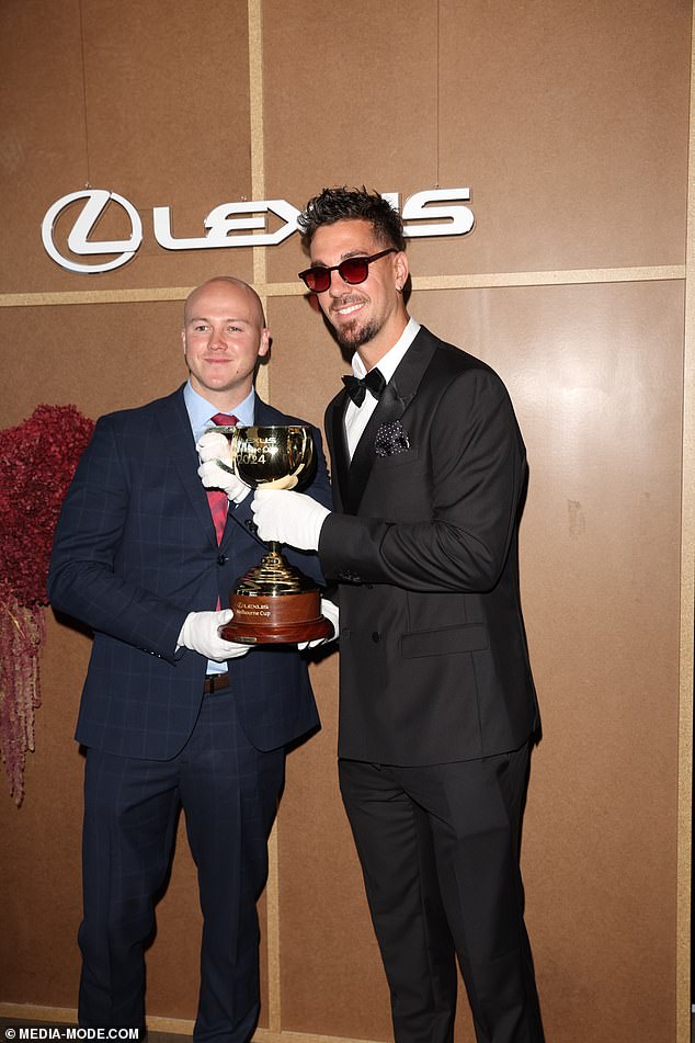 Australian tennis star Thanasi Kokkinakis was pictured playing the Melbourne Cup on Tuesday